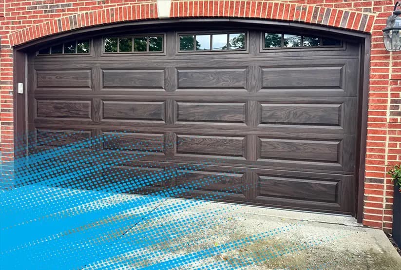 BH Garage Door technician finishing a new garage door installation